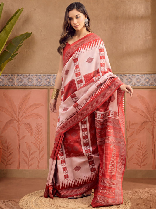 Woman wearing beige bhagalpuri silk saree with ikat resist-dyed pattern and red blouse