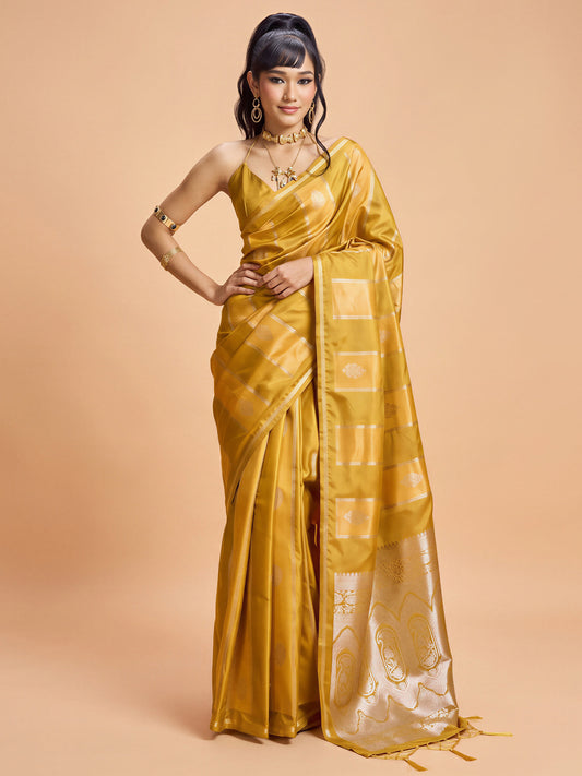 Woman wearing mustard satin saree with traditional indian motif work and mustard blouse