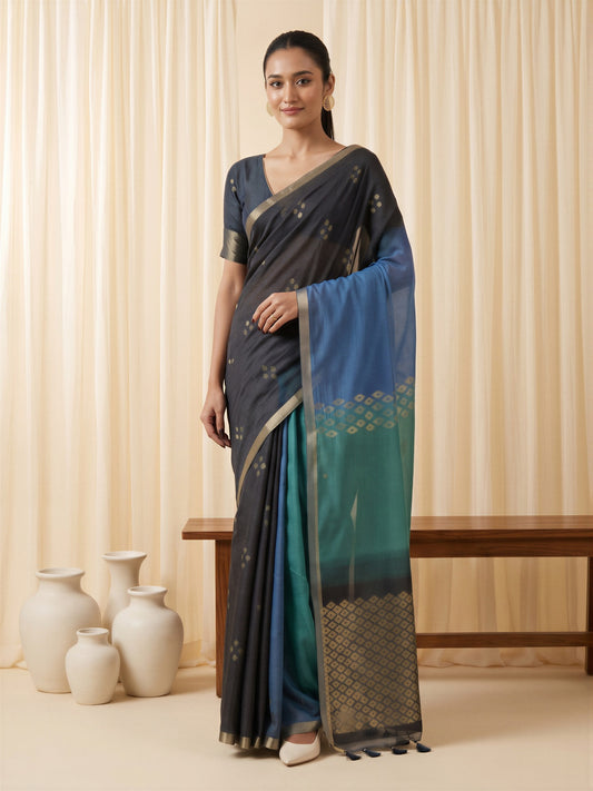 Woman wearing black viscose silk saree with traditional indian motif work and black blouse