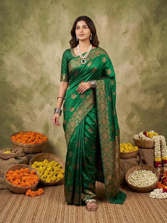 Woman wearing green silk blend saree with zari butta (metallic motif) work and green blouse