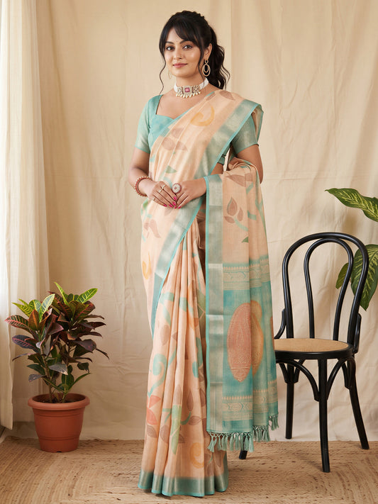 Woman wearing peach cotton silk saree with botanical floral and leaf design and sea green blouse