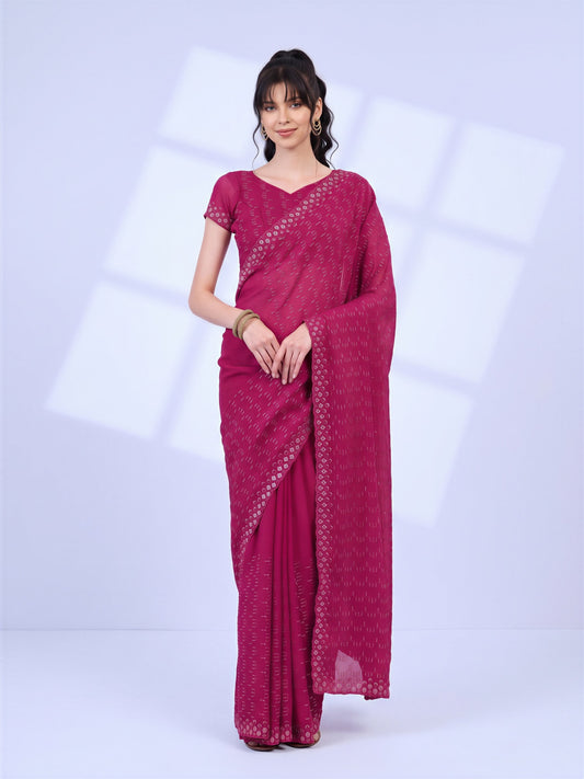 Woman wearing teal blue tissue saree with ornamented surface design and teal blue blouse