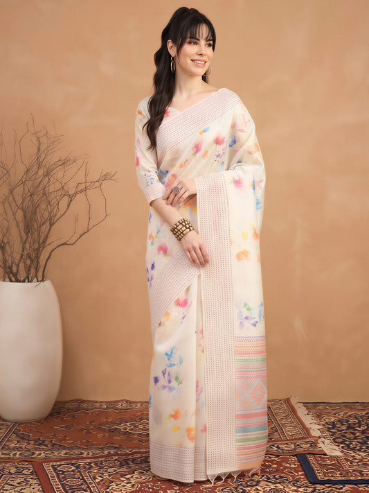 Woman wearing off white silk cotton saree with botanical floral and leaf design and off white blouse