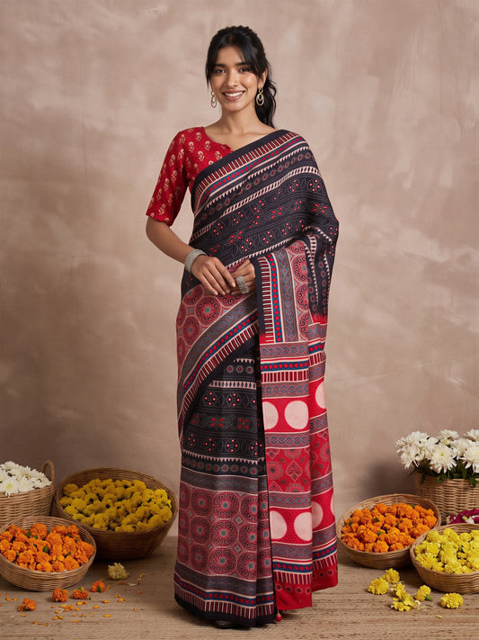 Woman wearing black viscose silk saree with ajrak block-print motif work and red blouse