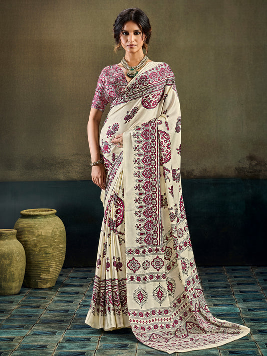 Woman wearing cream satin saree with ajrak block-print motif work and maroon blouse