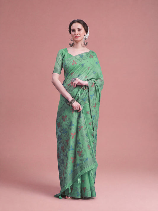 Woman wearing light green linen saree with all-over floral design and light green blouse
