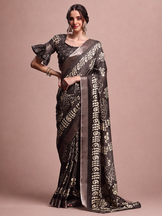 Woman wearing charcoal grey silk blend saree with traditional indian motif work and charcoal grey blouse