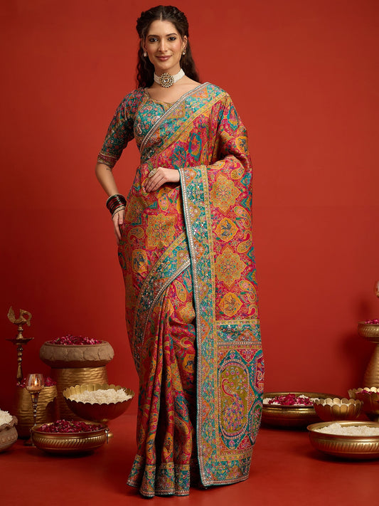 Woman wearing pink silk blend saree with traditional indian motif work and aqua blue blouse