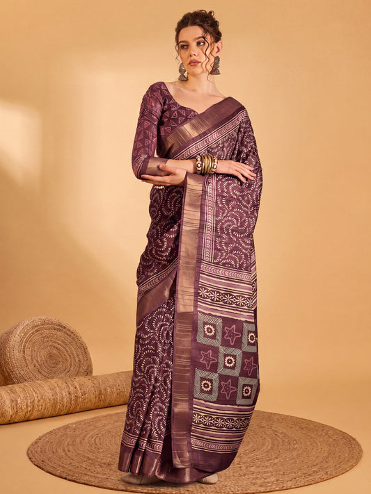Woman wearing wine silk blend saree with traditional indian motif work and wine blouse