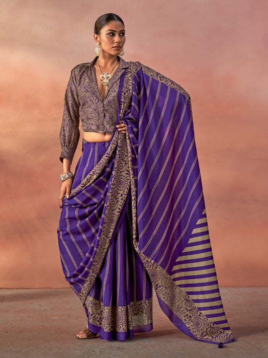 Woman wearing purple silk blend saree with traditional indian motif work and purple blouse