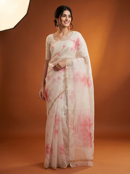 Woman wearing white organza saree with abstract contemporary design and pink blouse