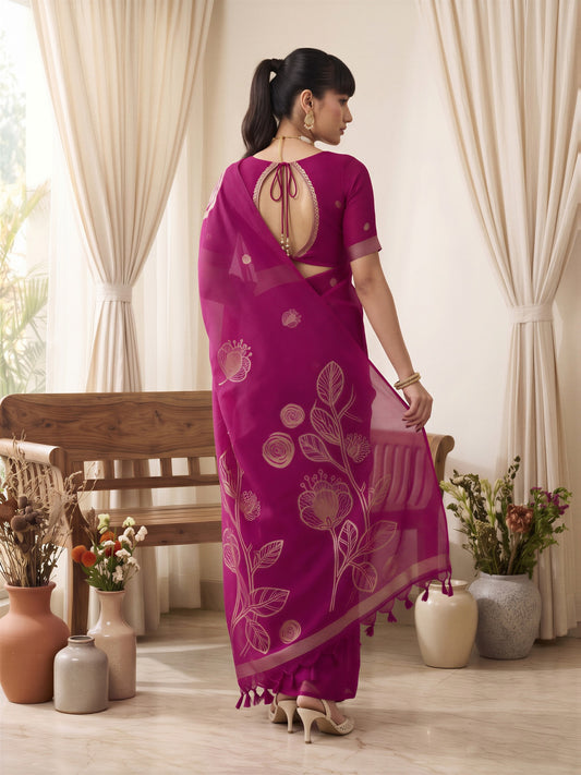 Woman wearing pink pure silk saree with all-over floral design and pink blouse