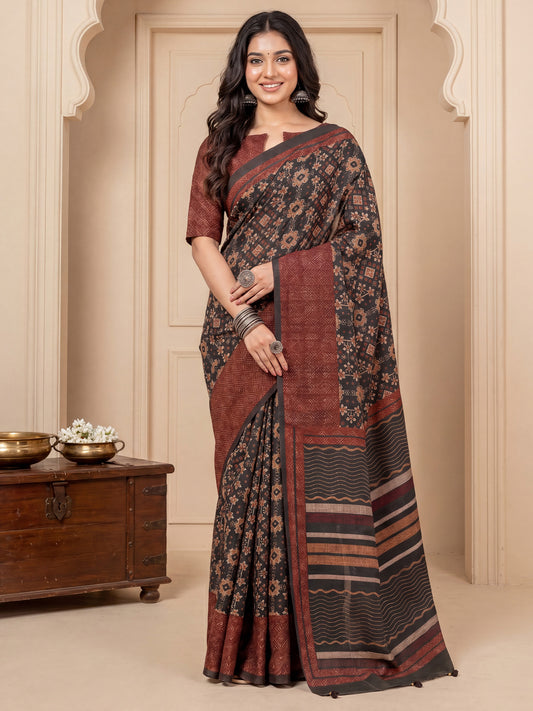 Woman wearing black silk blend saree with geometric pattern design and brown blouse