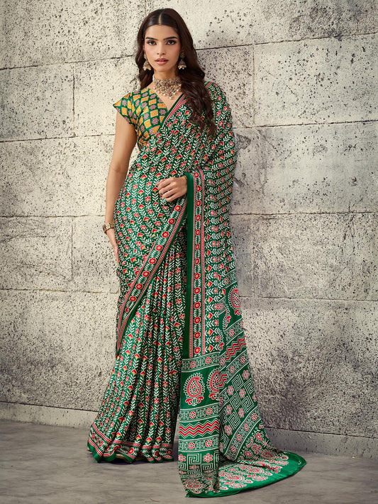 Woman wearing green satin saree with ajrak block-print motif work and rust blouse