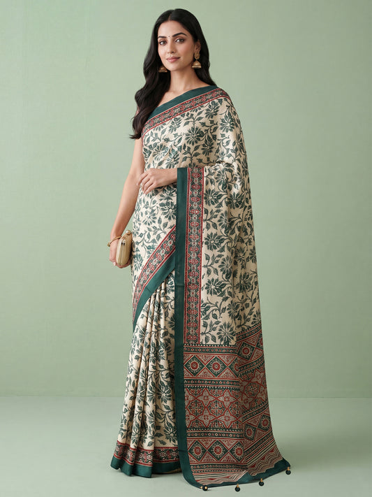 Woman wearing cream satin saree with ajrak block-print motif work and green blouse