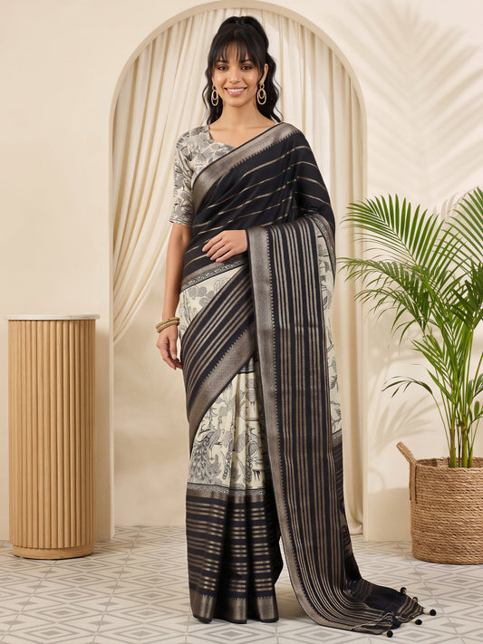 Woman wearing black viscose silk saree with botanical floral and leaf design and off white blouse