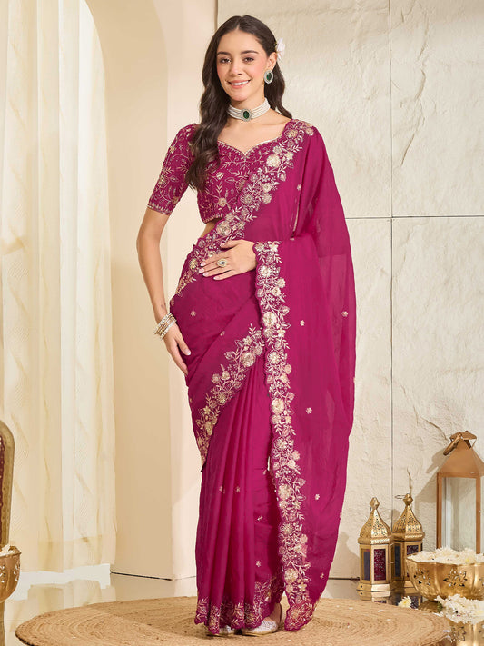 Woman wearing pink georgette saree with ornamented surface design and pink blouse