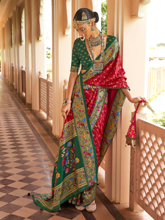 Woman wearing red silk blend saree with all-over floral design and green blouse