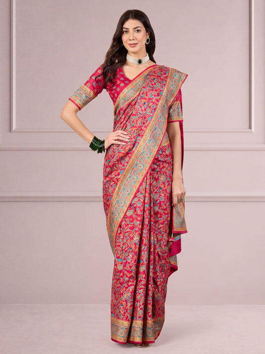 Woman wearing pink dola silk saree with traditional indian motif work and pink blouse