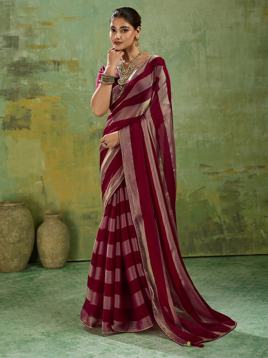 Woman wearing wine satin silk saree with colour-blocked design and wine blouse