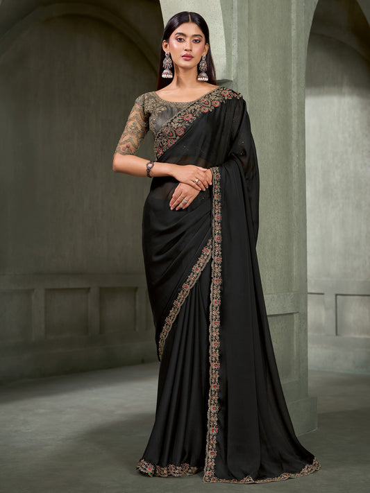 Woman wearing black chiffon saree with embroidered motif work and charcoal grey blouse