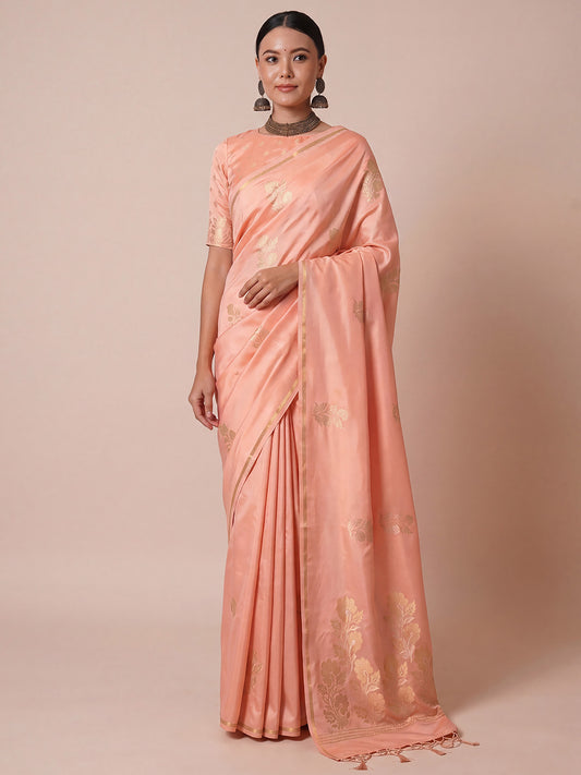 Woman wearing peach pure silk saree with zari butta (metallic motif) work and peach blouse