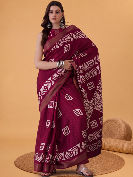 Woman wearing magenta silk blend saree with batik wax-resist design and magenta blouse