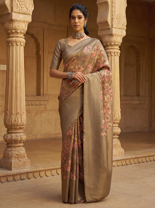 Woman wearing tan silk blend saree with all-over floral design and tan blouse