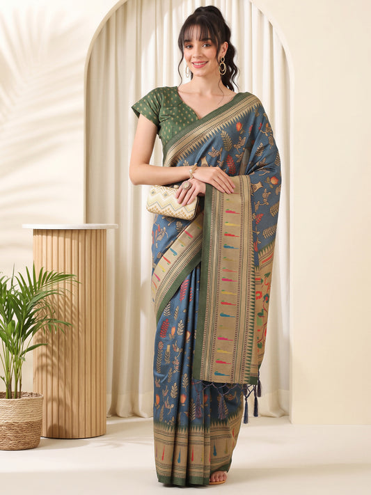 Woman wearing teal blue cotton blend saree with botanical floral and leaf design and green blouse
