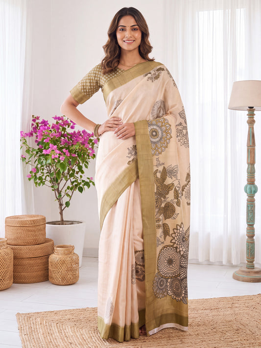 Woman wearing white satin silk saree with traditional indian motif work and light green blouse