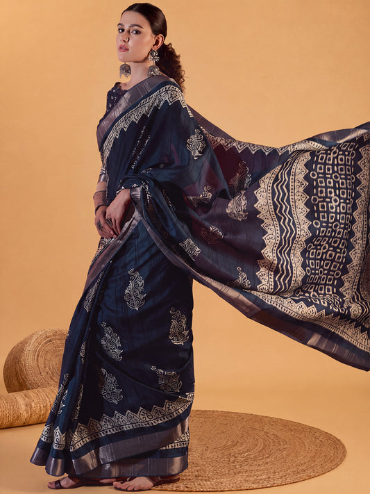 Woman wearing teal blue silk blend saree with dabu mud-resist print work and teal blue blouse