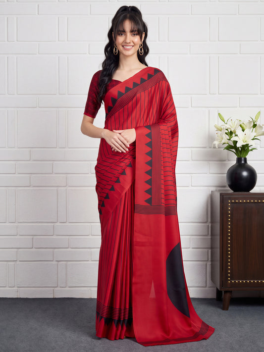 Woman wearing red satin saree with striped pattern design and red blouse