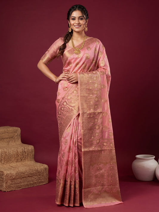 Woman wearing pink silk blend saree with zari butta (metallic motif) work and pink blouse