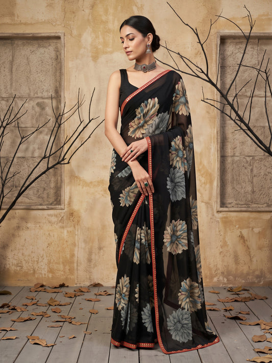 Woman wearing black georgette saree with all-over floral design and black blouse