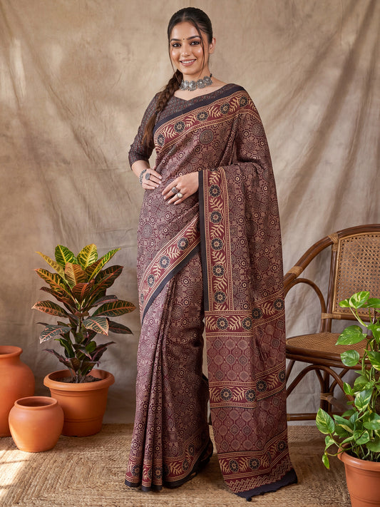 Woman wearing maroon silk blend saree with ajrak block-print motif work and multicolored blouse
