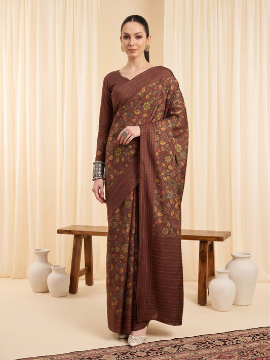Woman wearing brown silk blend saree with kalamkari narrative motif work and brown blouse