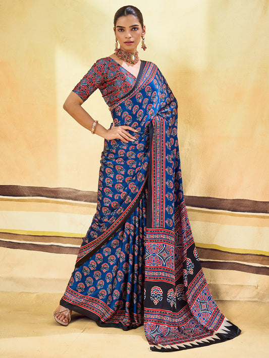 Woman wearing blue satin saree with ajrak block-print motif work and red blouse
