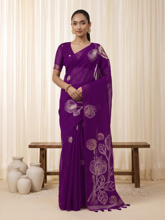 Woman wearing purple pure silk saree with all-over floral design and purple blouse