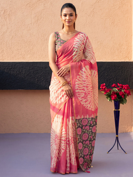 Woman wearing pink cotton blend saree with shibori resist-dye pattern and multicolored blouse