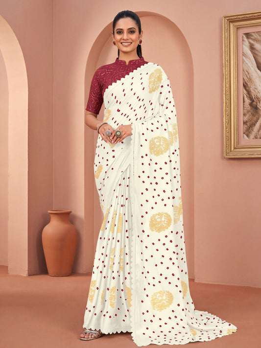 Woman wearing white chiffon saree with bandhani tie-dye dot work and magenta blouse