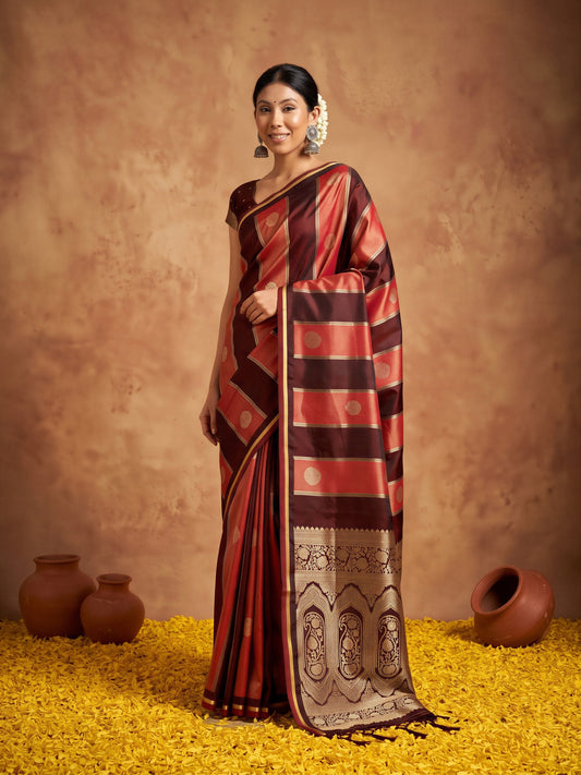 Woman wearing maroon satin saree with traditional indian motif work and maroon blouse