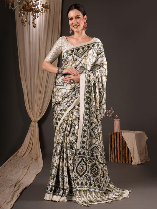 Woman wearing off white satin saree with ajrak block-print motif work and off white blouse