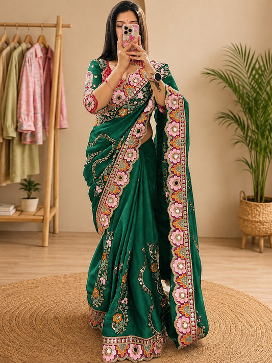 Woman wearing green pure georgette saree with all-over floral design and green blouse