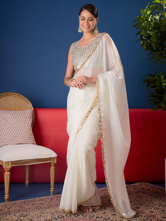 Woman wearing white pure chiffon saree with clean solid-tone finish and white blouse