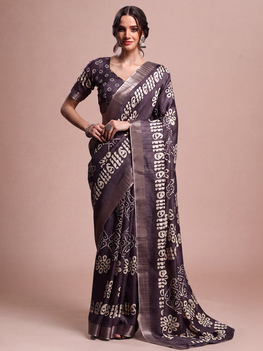 Woman wearing violet silk blend saree with traditional indian motif work and violet blouse