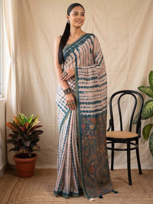 Woman wearing peach cotton blend saree with tie-and-dye resist pattern and peach blouse
