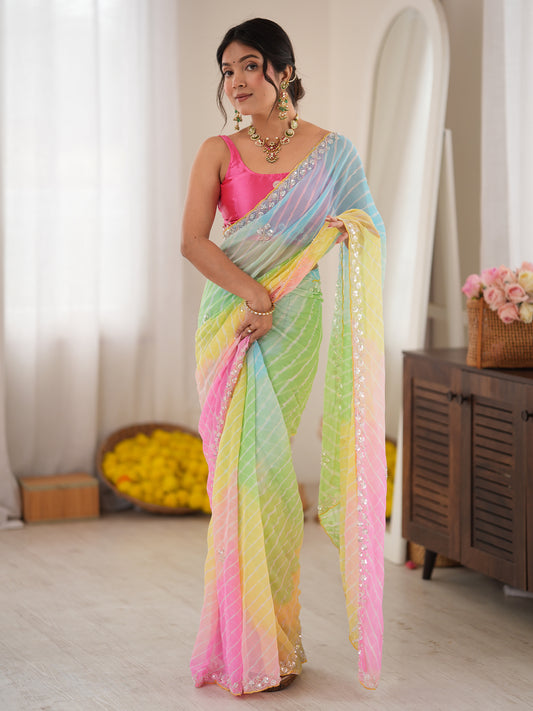 Woman wearing multicolored georgette saree with leheriya diagonal wave stripes and pink blouse