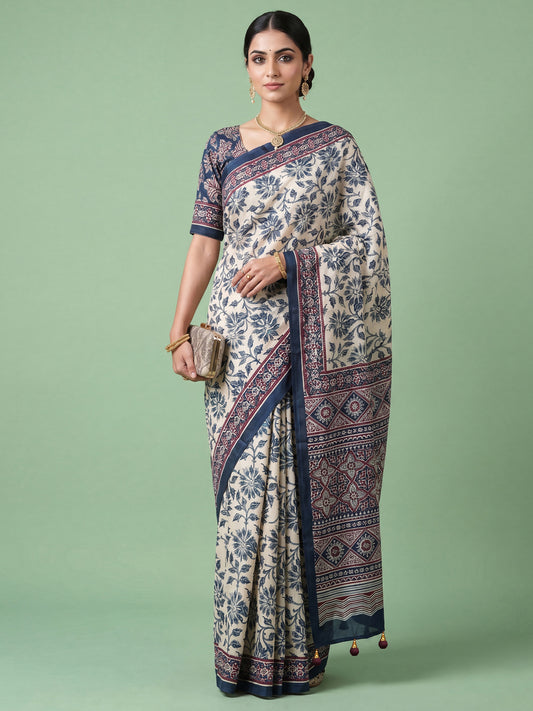 Woman wearing cream satin saree with ajrak block-print motif work and navy blue blouse