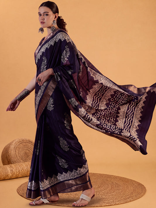 Woman wearing purple silk blend saree with dabu mud-resist print work and purple blouse