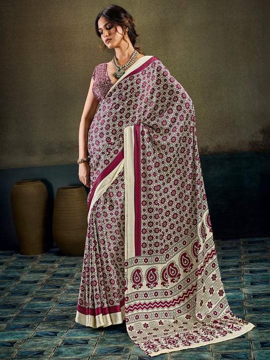 Woman wearing cream satin saree with ajrak block-print motif work and maroon blouse